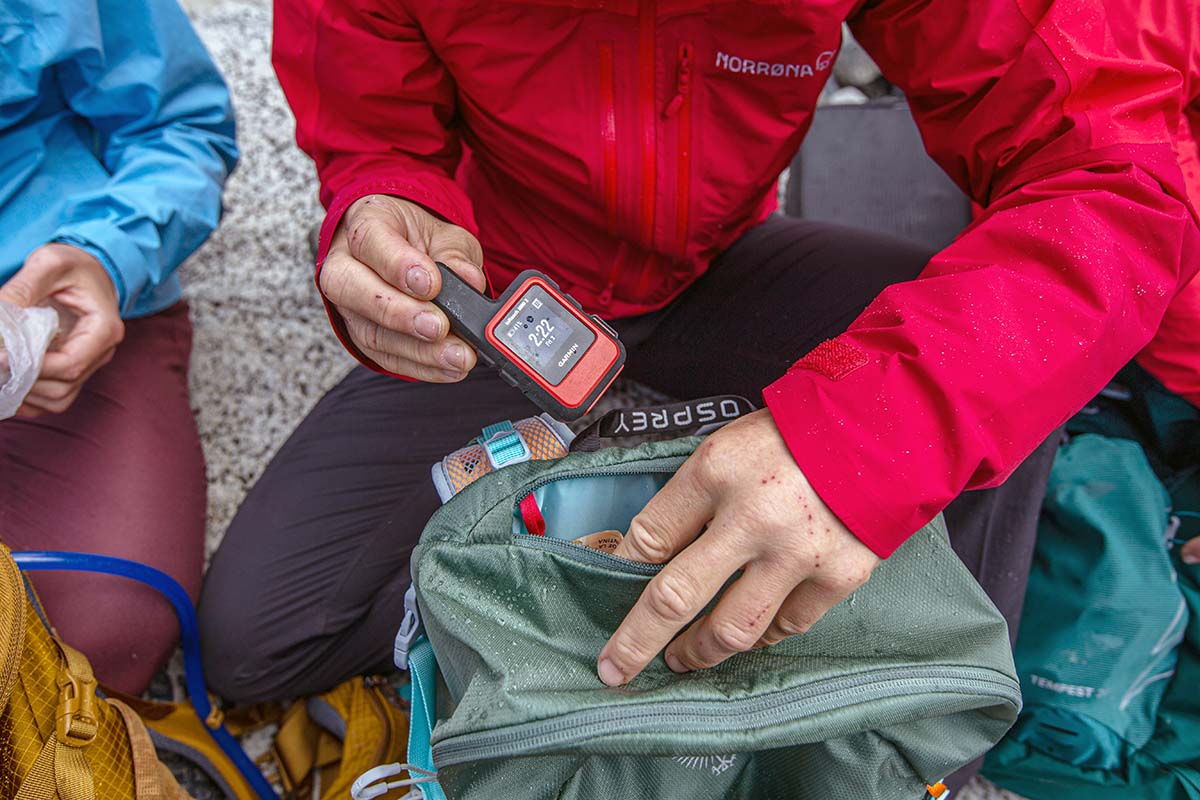 Retrieving Garmin inReach Mini 2 from daypack accessory pocket